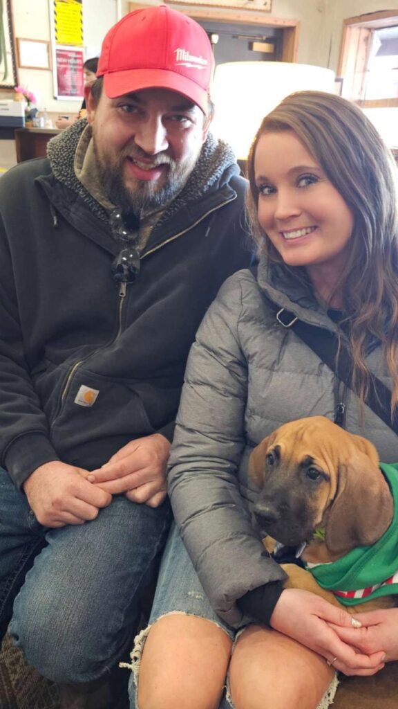 Marlin a fawn Great Dane puppy with his new family